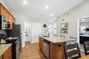 Plainfield apartment for rent - A kitchen with wooden cabinets and a granite countertop.