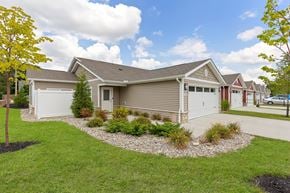 Batavia apartment for rent - A house with a grey roof and a white garage door.