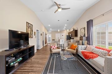 Reynoldsburg apartment for rent - A living room with a white couch and a television.