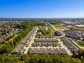 Shelby Twp apartment for rent - A bird's eye view of a residential area with houses and apartment buildings.