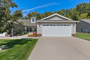 Shelby Twp apartment for rent - A house with a grey roof and a white garage door.
