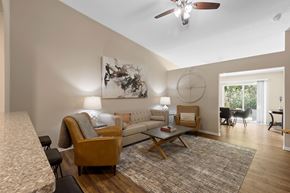 Shelby Twp apartment for rent - A living room with a couch, chairs, and a rug.