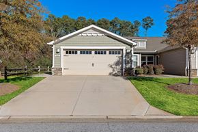 Simpsonville apartment for rent - A two-car garage is attached to a house.