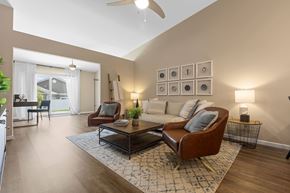 South Lebanon apartment for rent - A living room with a brown leather chair and a coffee table.