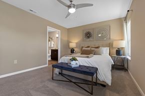 South Lebanon apartment for rent - A bedroom with a bed, nightstand, and a ceiling fan.