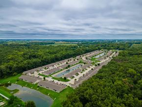 Sylvania apartment for rent - A bird's eye view of a resort with a swimming pool and a lake.