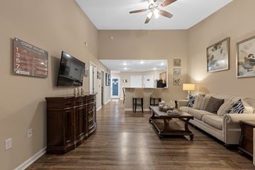 Sylvania apartment for rent - A living room with a white couch and a wooden coffee table.