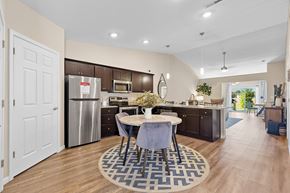 Kalamazoo apartment for rent - A kitchen with a table and chairs in the middle of the room.