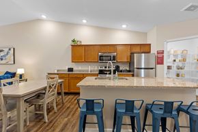 Tipp City apartment for rent - A kitchen with a table and chairs.