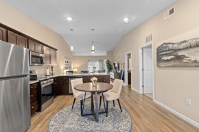 Troutman apartment for rent - A kitchen with a table and chairs in the middle of the room.