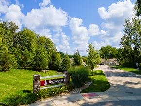 Union Township apartment for rent - A sign that says Redwood stands in front of a grassy area.