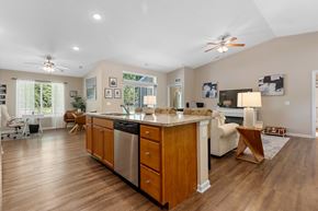 Union Township apartment for rent - A kitchen with wooden cabinets and a stainless steel dishwasher.