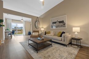 Volo apartment for rent - A living room with a white couch, a coffee table, and a painting on the wall.