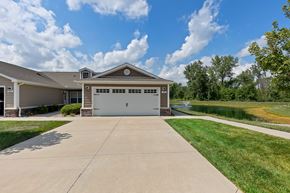 Washington Township apartment for rent - A house with a garage and a driveway in front of it.