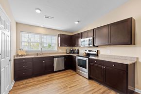Westfield apartment for rent - A kitchen with brown cabinets and stainless steel appliances.