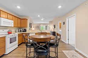 Westfield apartment for rent - A kitchen with a table and chairs in the middle of the room.