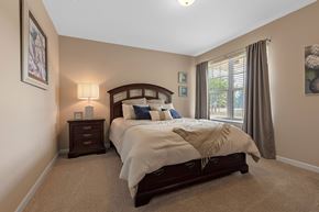 Westfield apartment for rent - A bedroom with a large bed and a window with curtains.