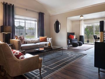 Waukee apartment for rent - a living room with couches and chairs and a rug