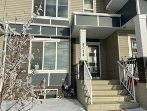 Edmonton apartment for rent - A house numbered 503 is shown with snow on the ground and a tree in front.