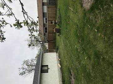 Edmonton apartment for rent - A building with a green lawn in front of it.