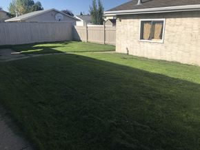 Edmonton apartment for rent - A house with a brown roof and a white garage door.