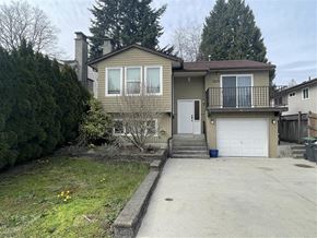 Coquitlam apartment for rent - a house with a driveway and a white garage door