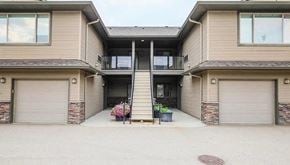 Lake Country townhouse for rent - A two-story house with a garage on each floor.