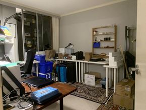 Vancouver apartment for rent - a cluttered office with a desk and a computer