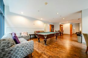 Vancouver condo for rent - A room with a pool table and a couch.