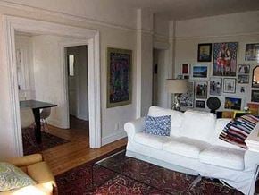 Vancouver apartment for rent - a living room with a white couch and a rug