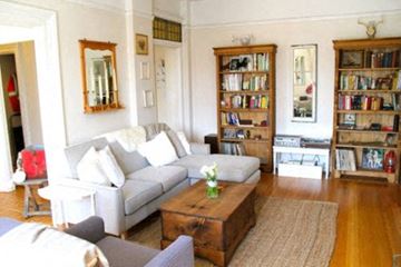 Vancouver apartment for rent - A living room with a white couch and a coffee table.