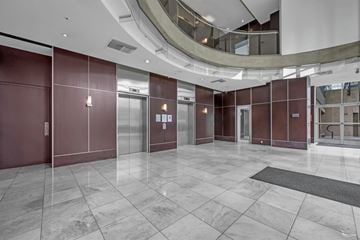 Vancouver condo for rent - A hallway with maroon walls and a grey floor.