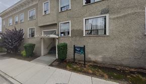 Vancouver apartment for rent - A building with a sign that says "KAWAII HAPPINESS" on it.