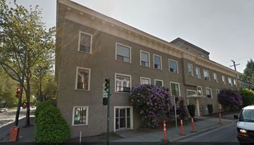 Vancouver apartment for rent - a building on the corner of a street with a traffic light