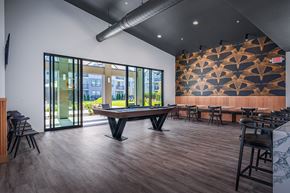 Marysville apartment for rent - A modern dining room with a long table and chairs.