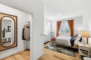 Marysville apartment for rent - a bedroom with a mirror and a bed and a dresser