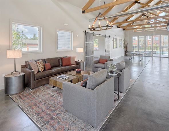 Marysville apartment for rent - A living room with a grey couch and a wooden floor.