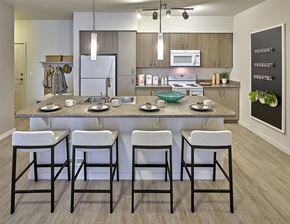 Marysville apartment for rent - A modern kitchen with a dining table and chairs.