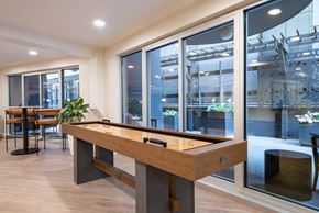 Seattle apartment for rent - A pool table in a room with a view of the outside.