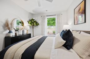 Gaithersburg apartment for rent - an example of a bedroom with a bed and a window