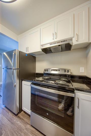 Hayward apartment for rent - A kitchen with a stainless steel refrigerator and stove.
