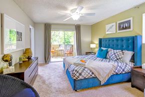 Irvine apartment for rent - a bedroom with a bed and a ceiling fan