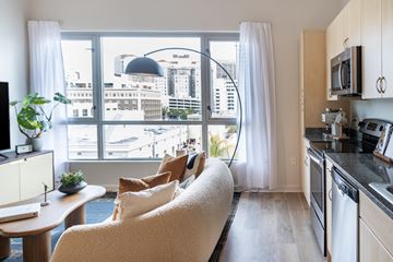 San Diego apartment for rent - A living room with a couch and a view of the city.