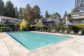 Bellevue apartment for rent - A swimming pool surrounded by lounge chairs and umbrellas.