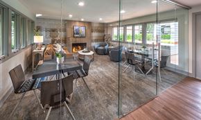 Bellevue apartment for rent - A modern dining room with a glass table and chairs.