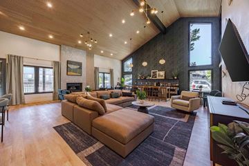 Tigard apartment for rent - A living room with a brown sofa and a wooden floor.