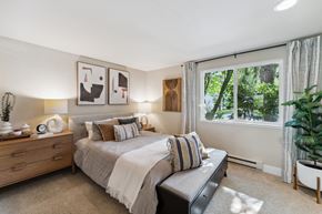 Sammamish apartment for rent - a bedroom with a bed and a large window
