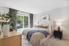 Beaverton apartment for rent - a bedroom with a bed and a large window