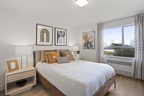 Seattle apartment for rent - a bedroom with a large bed and a window