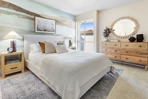Los Angeles apartment for rent - a bedroom with a bed and a dresser and a mirror